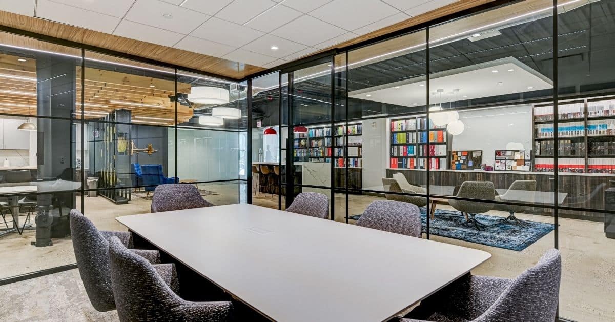 Modern office space with employees collaborating in a relaxed environment